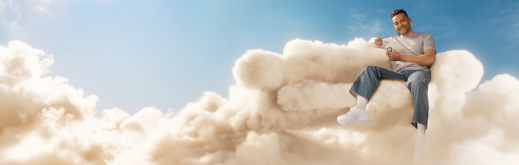 a man sitting on a cloud
